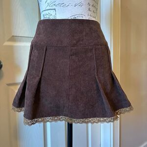 Brown corduroy pleated mini skirt with lace trim